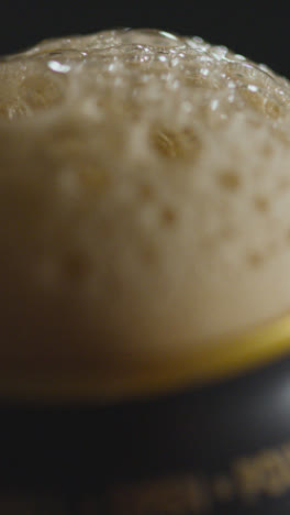 Vertical-Video-Close-Up-Of-Pulling-Ring-Pull-On-Can-Of-Irish-Stout-To-Celebrate-St-Patricks-Day